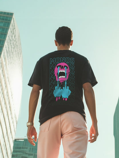 Person wearing a black t-shirt with colorful graphic design outdoors